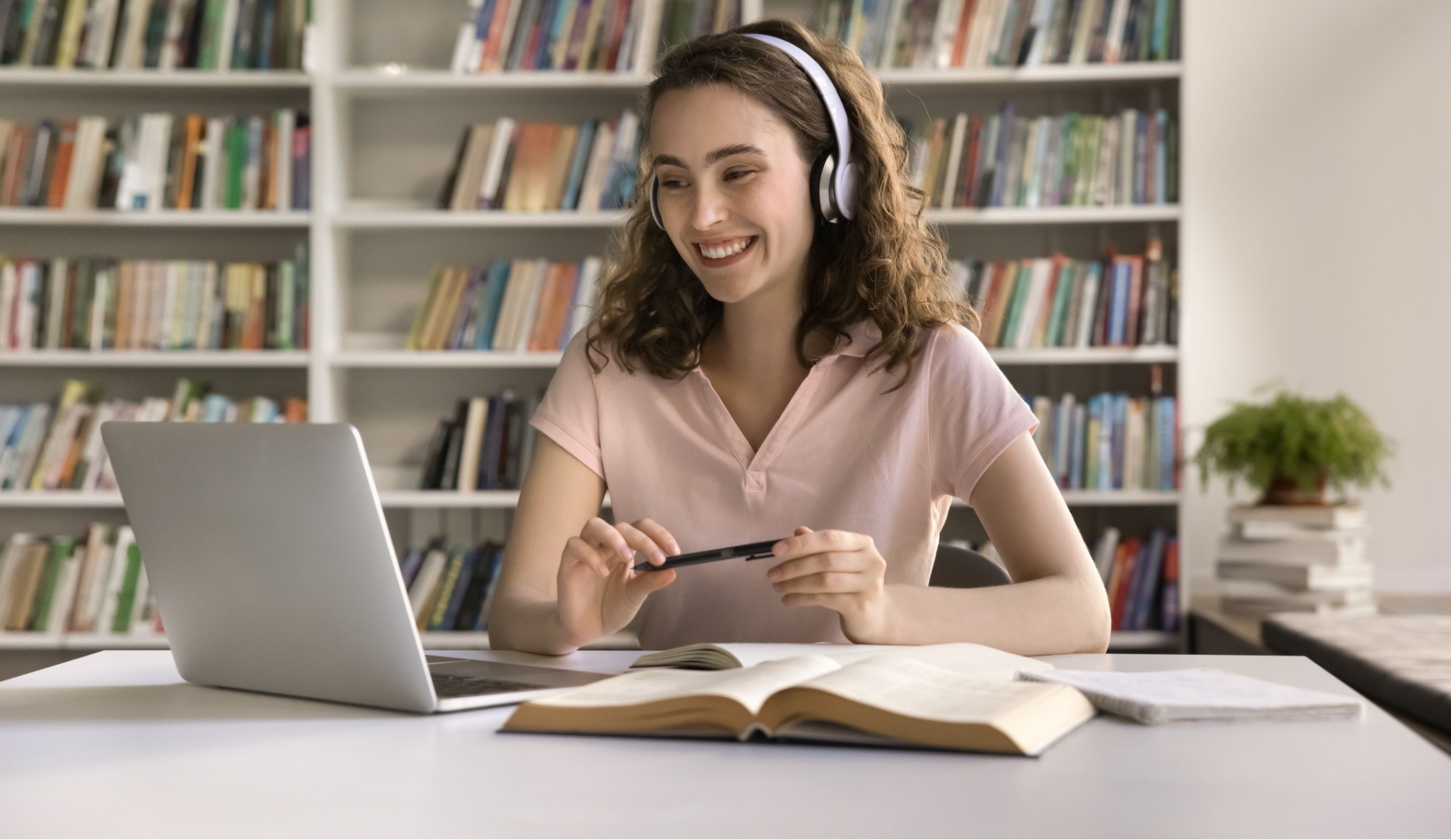 Student recieving STEM tutoring online and making notes