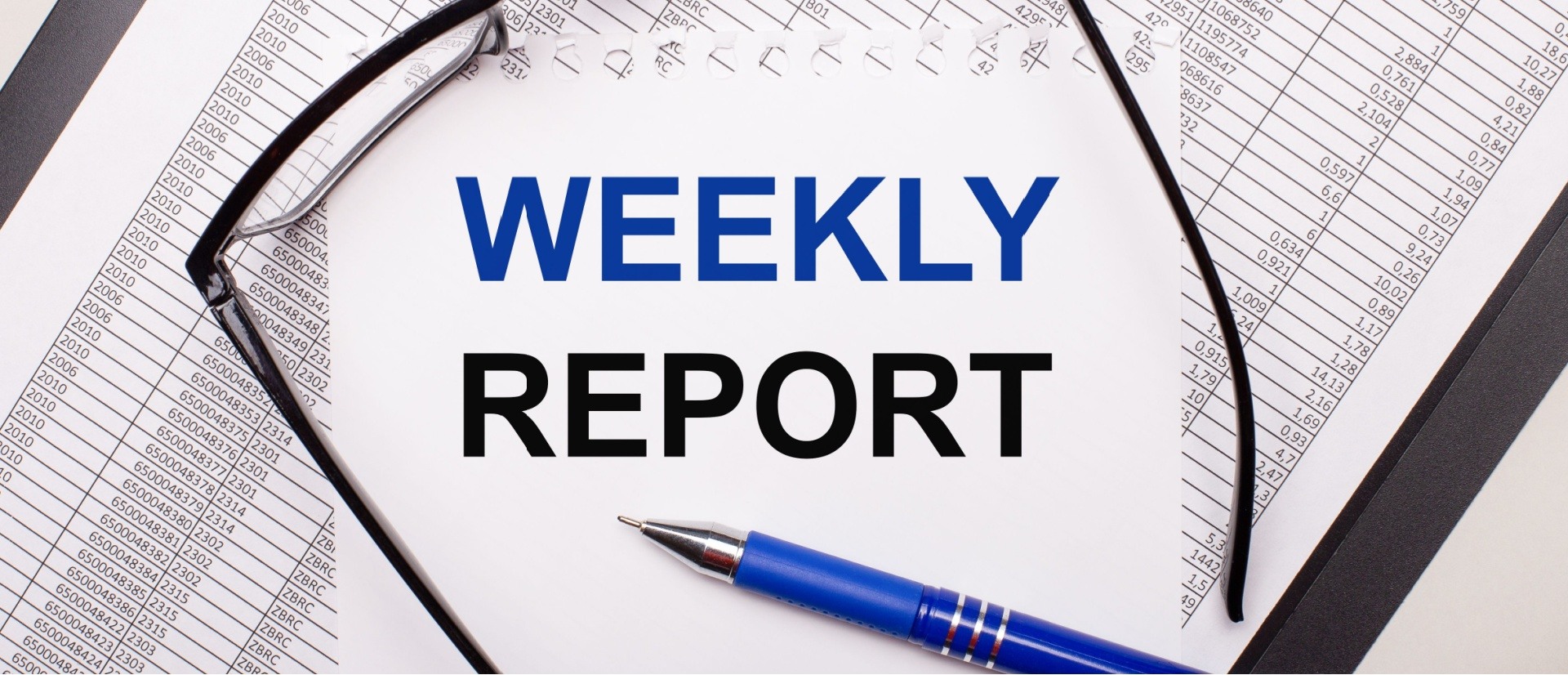 Weekly report graphic with glasses and a pen on the paper. 
