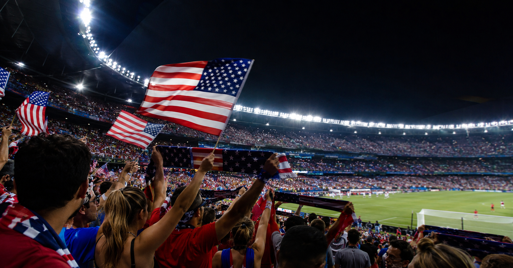 American soccer fans in red, white and blue packing a modern stadium at night under floodlights, scarves and flags raised, electric World Cup atmosphere -->
