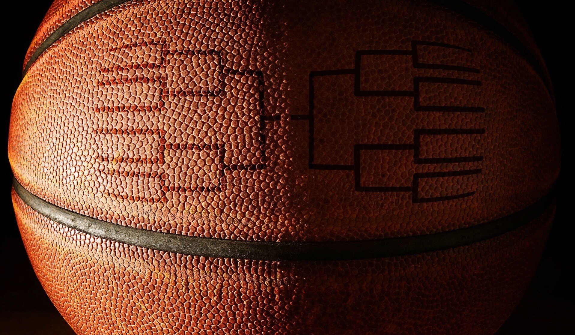 March Madness bracket on a basketball