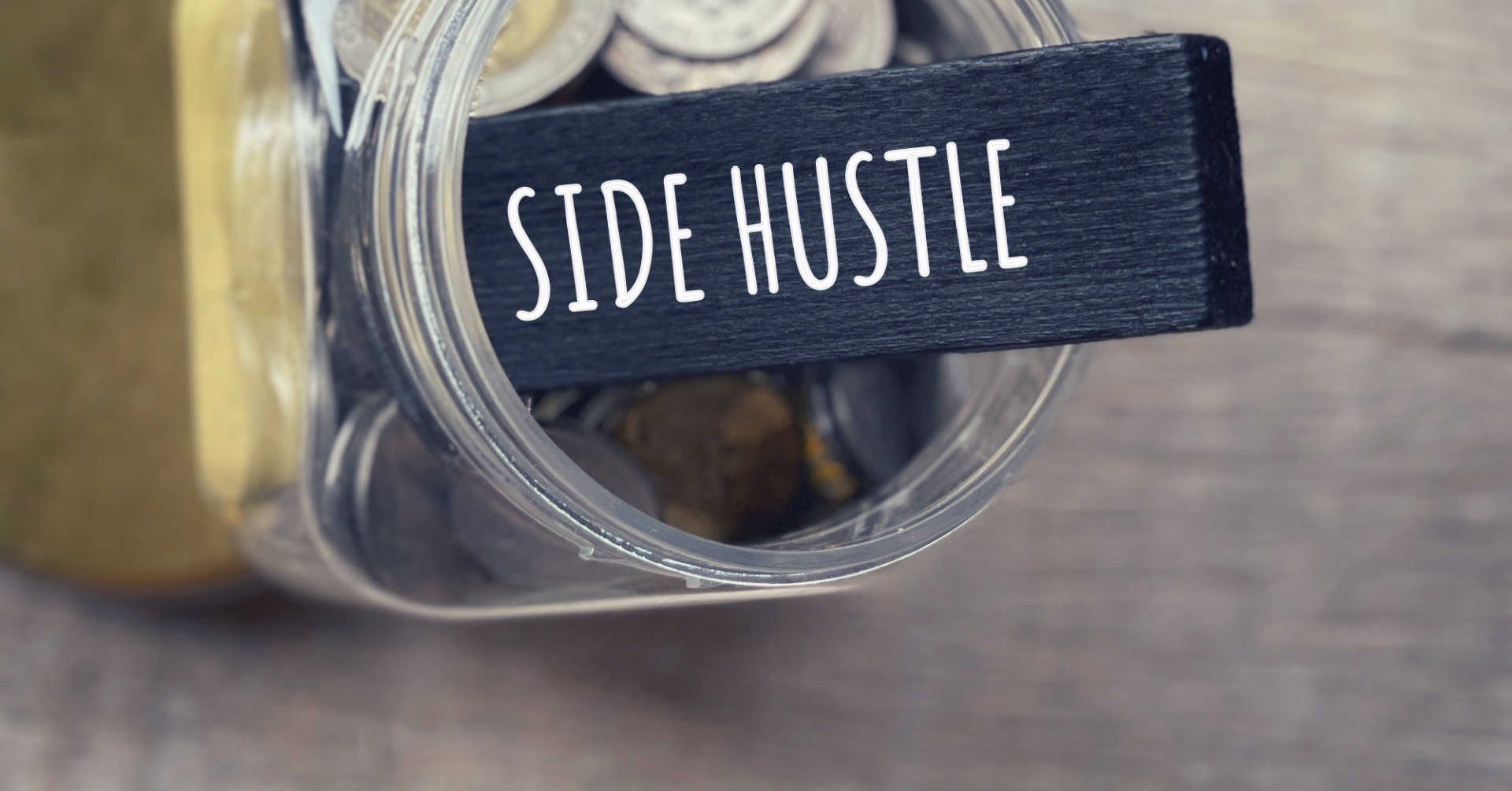 Side hustle slab in a jar that has coins in it 