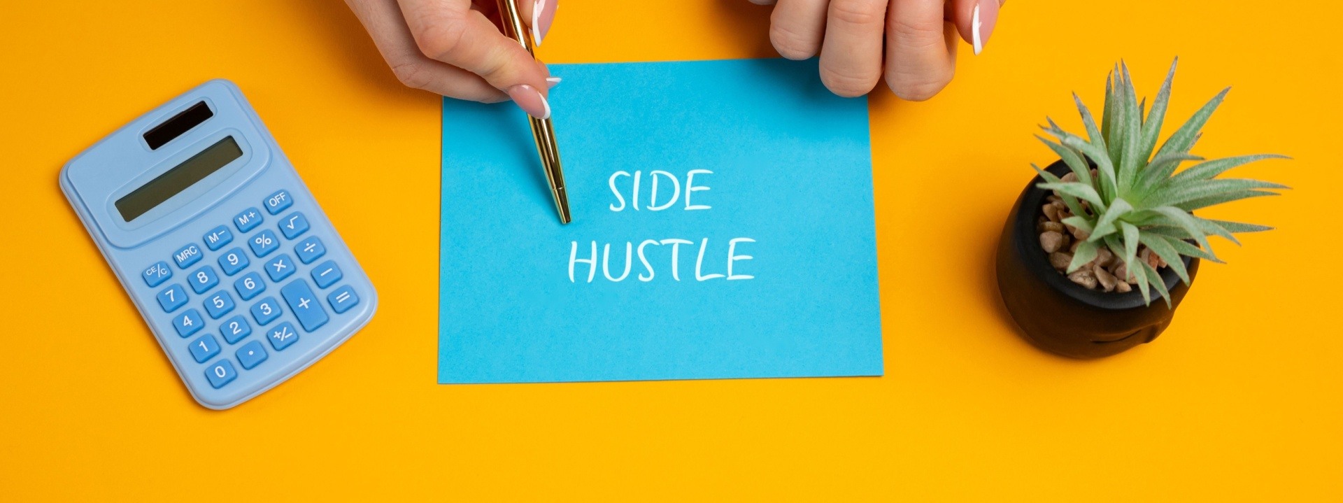 Side hustle with a woman holding a pen