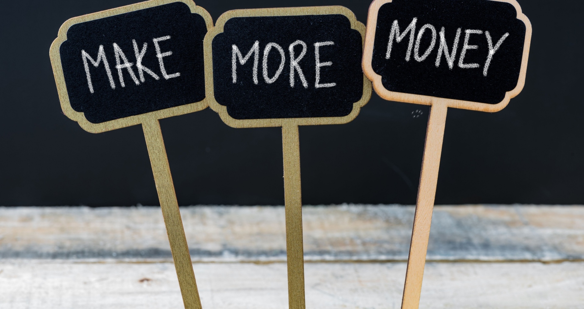 Signs that say make, more and money 