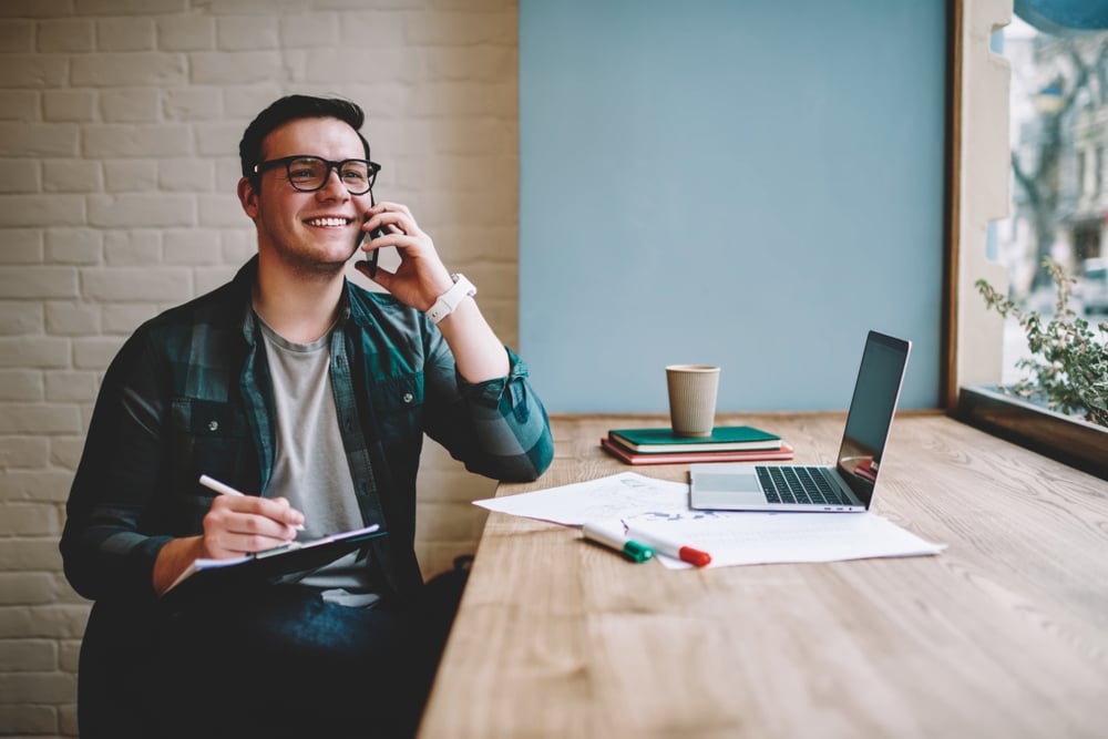 Man freelancing in coffee shop