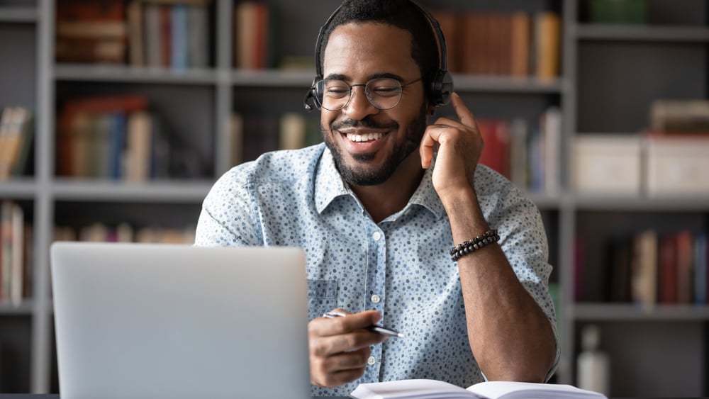 Virtual Assistant using laptop with headset on