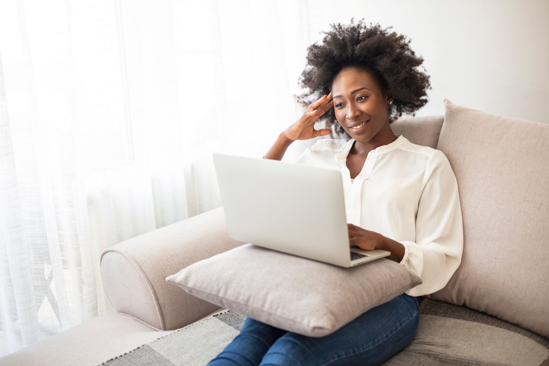 woman on laptop working on her side hustle